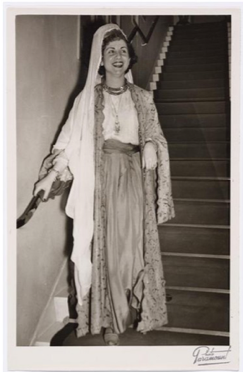 Woman dressed in costume posing on stairs
