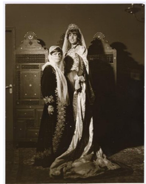 A pair of women dressed in costumes