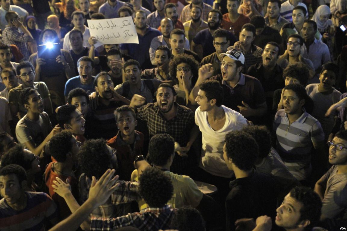 Drummer Evokes the Joyous, Hopeful Mood of the 2011 Uprising. Image by Hamada Elrasam for "Voice of America," https://gdb.voanews.com/2AC07221-4532-400E-B002-8CCF93762FE3_mw1228_mh527_s.jpg.