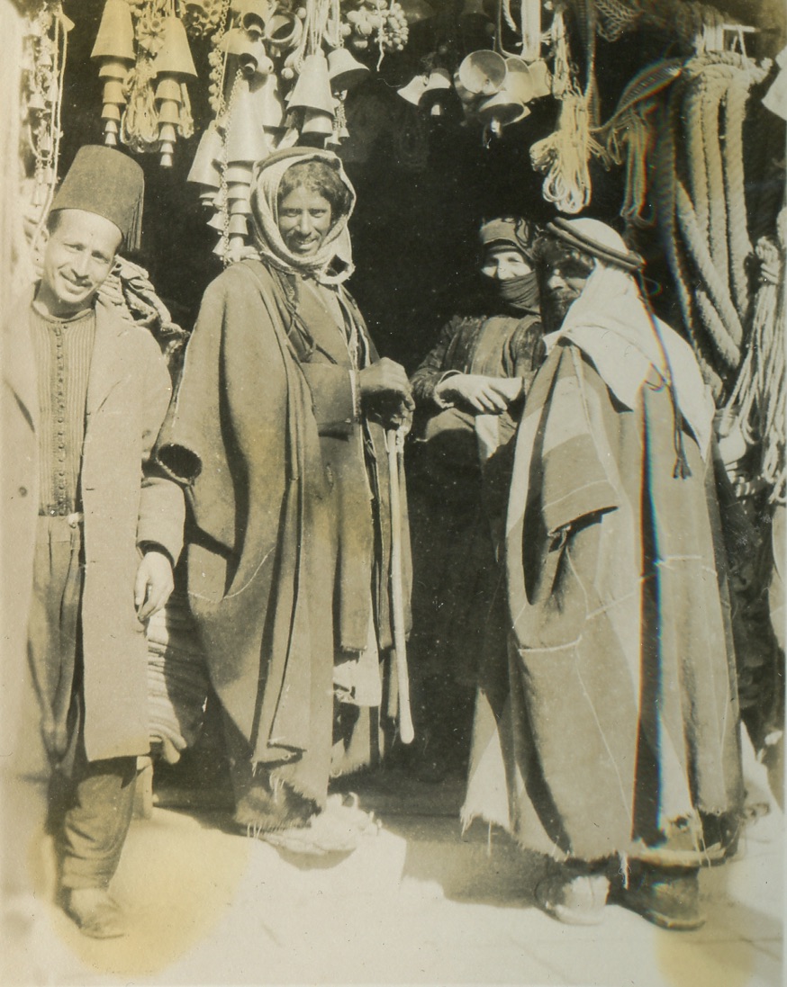 A photo of people in Jerusalem who seem to be by a street stand. From the archives of Moise A. Khayrallah Center for Lebanese Diaspora Studies.